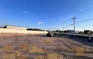 Messy bumpy dirt piles before grading and sod installation in Southwest Florida