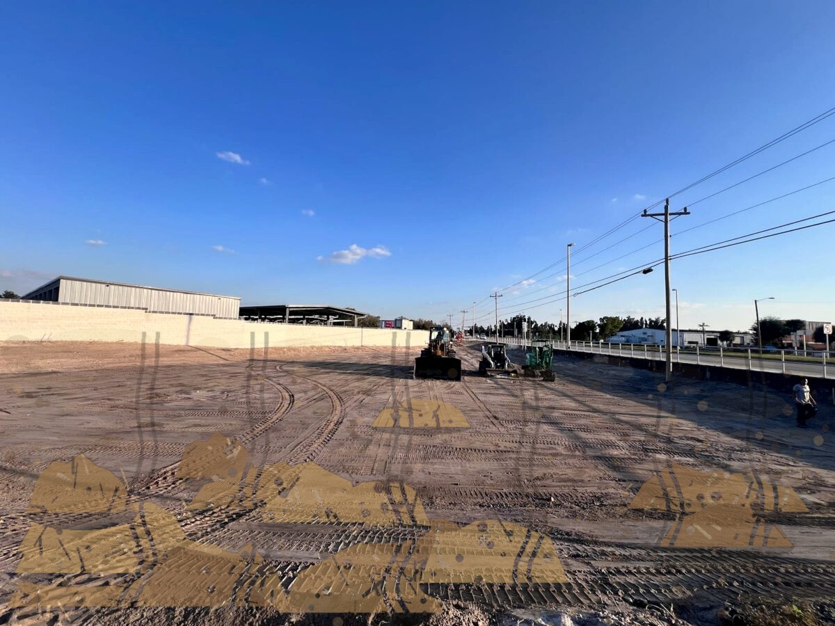 Messy bumpy dirt piles before grading and sod installation in Southwest Florida